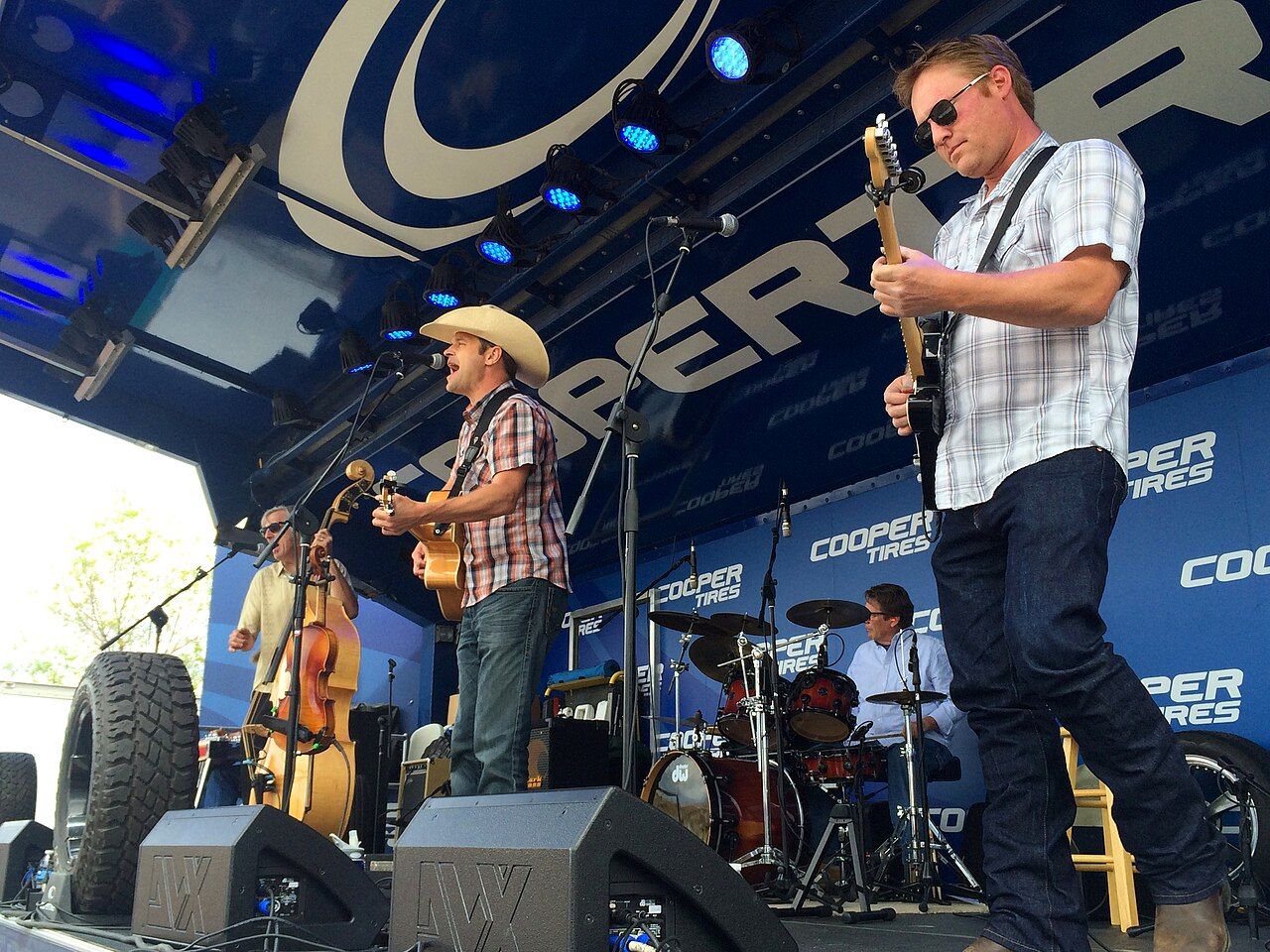 A country band on an outdoor stage (stock photo, not at the Icehouse)